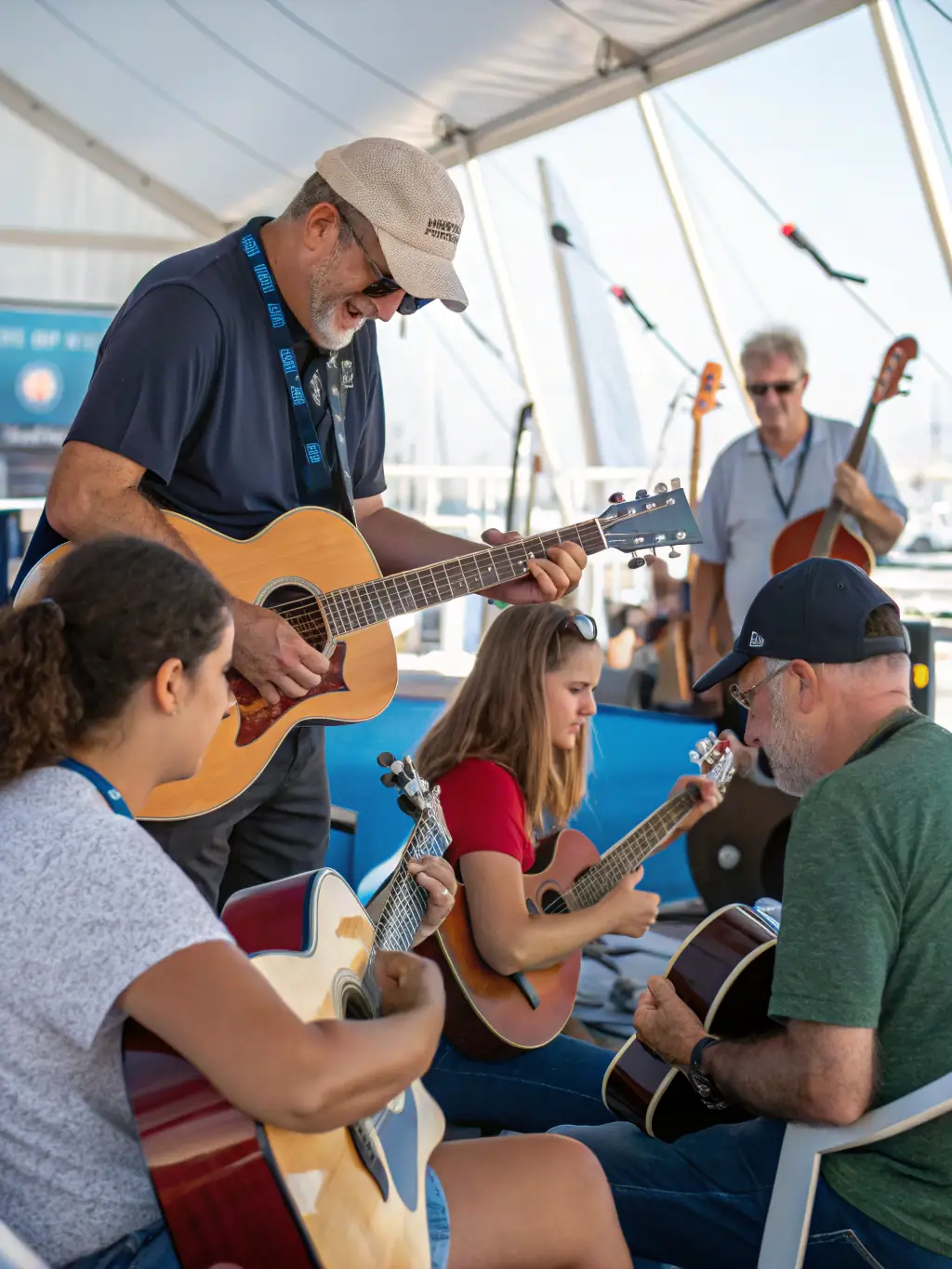 A vibrant photo of a blues workshop in progress, showing participants learning guitar techniques from an experienced instructor at LA NUIT BLANCHE DU BLUES.